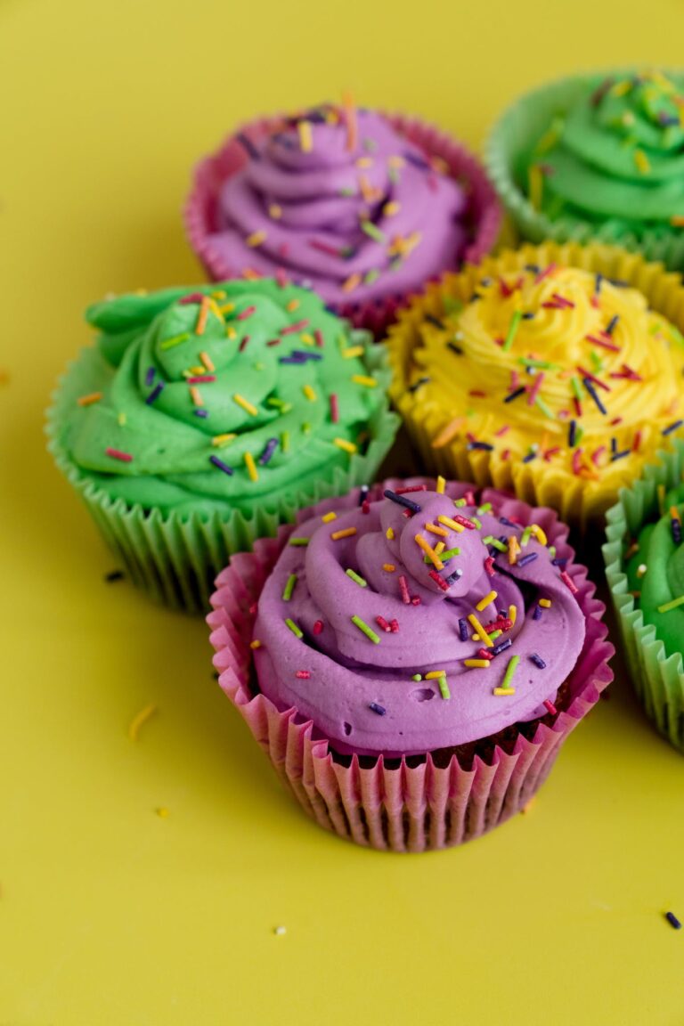 Creamy Cupcakes On Yellow Background